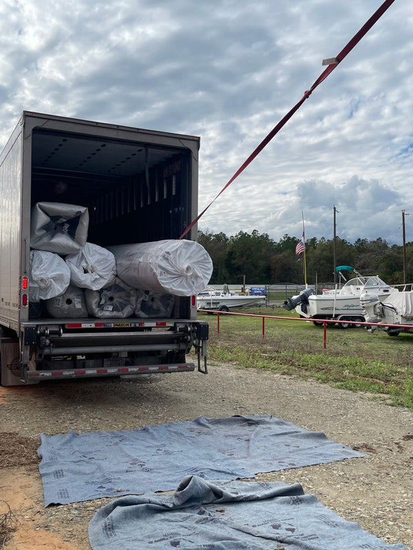 sports turf unloading freight