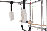 Close-up of padded loops and springs on the Echo Kodiak Echo Pilates Cadillac Reformer Vintage against a white background.