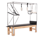 The Echo Kodiak Echo Pilates Cadillac Reformer Vintage features a solid Oak base, black padding, metal frame, and straps.
