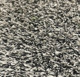 Close-up of Pro Performance 45 Sports & Fitness Turf by Athletic Textiles, showing gray hybrid fibers with scattered rubber infill.