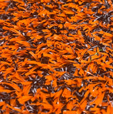 Close-up of Pro Performance 45 Sports & Fitness Turf by Athletic Textiles shows textured orange and black hybrid fibers.