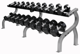 A rack holds Troy TSD-R 12-Sided Dumbbells by Troy Barbell, silver handles, rubber-encased, arranged by size.
